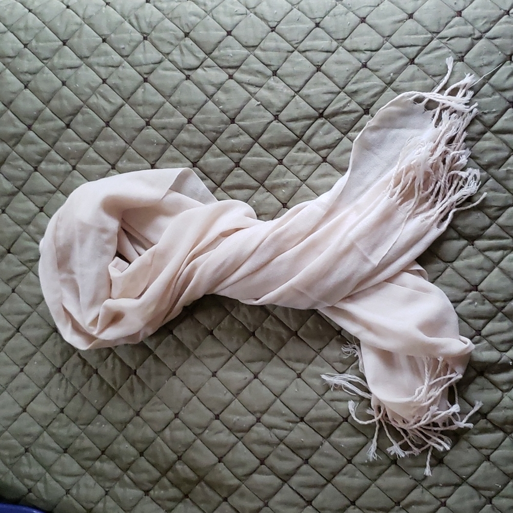 Understated scarf or wrap in very light tan or cream color